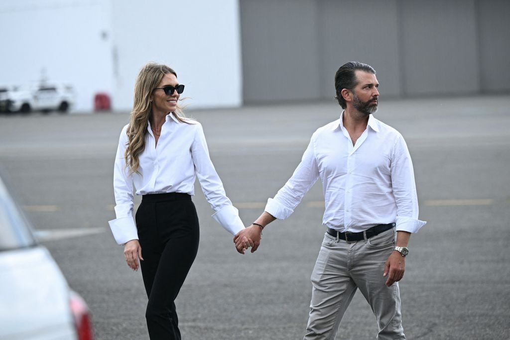 photo of donald trump jr and bettina anderson holding hands