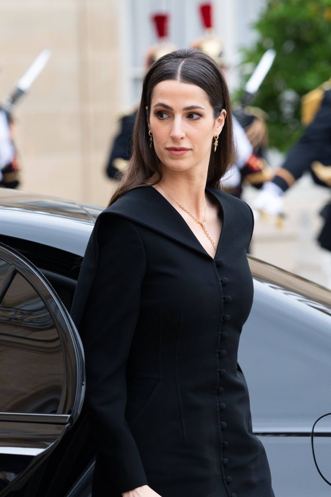 Princess Rajwa Al Hussein in black outfit exiting car