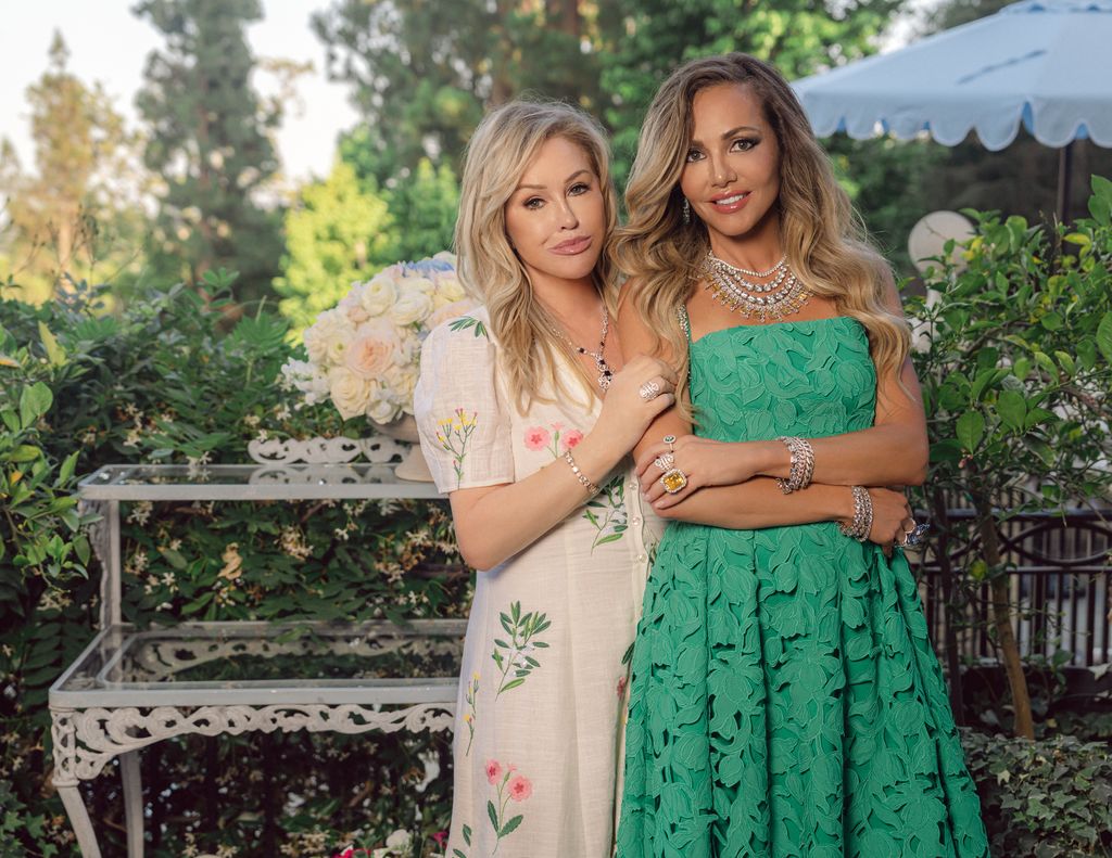 Kathy Hilton and Anna Zuckermann pose in Kathy Hilton's garden
