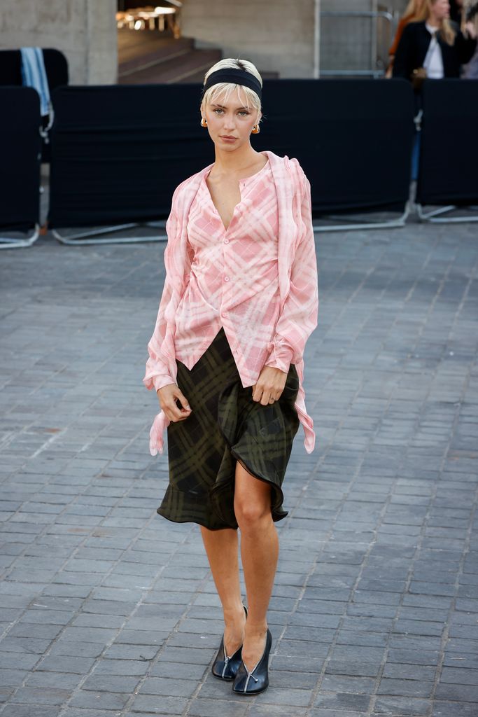 Iris Law attends the Burberry show during London Fashion Week September 2024 at the National Theatre on September 16, 2024 in London, England