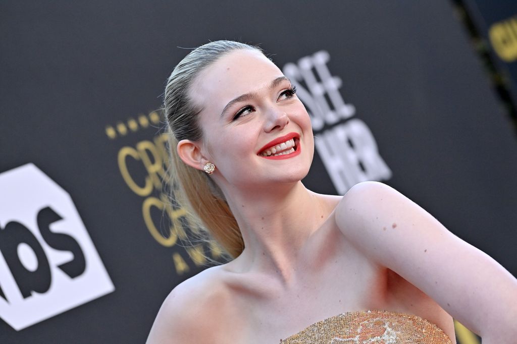 Elle Fanning looks gorgeous with red lipstick on red carpet