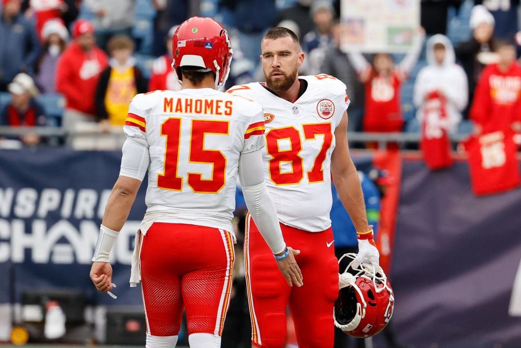 Kansas City Chiefs quarterback Patrick Mahomes (15) and Kansas City Chiefs tight end Travis Kelce (87) in warm up before a game between the New England Patriots and the Kansas City Chiefs on December 17, 2023, at Gillette Stadium in Foxborough, Massachusetts