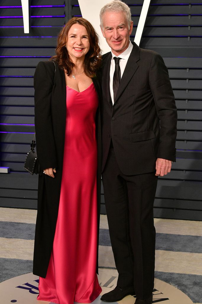 Patty Smyth in a red dress and John McEnroe in a suit