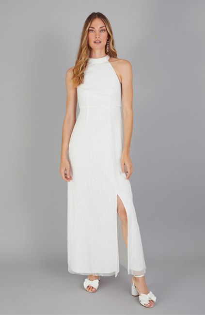 model wearing white embellished halterneck gown