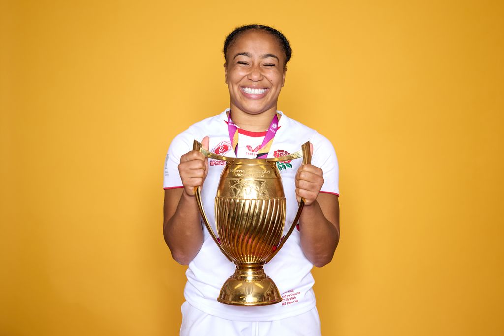 Sadia Kabeya holding rugby trophy in kit