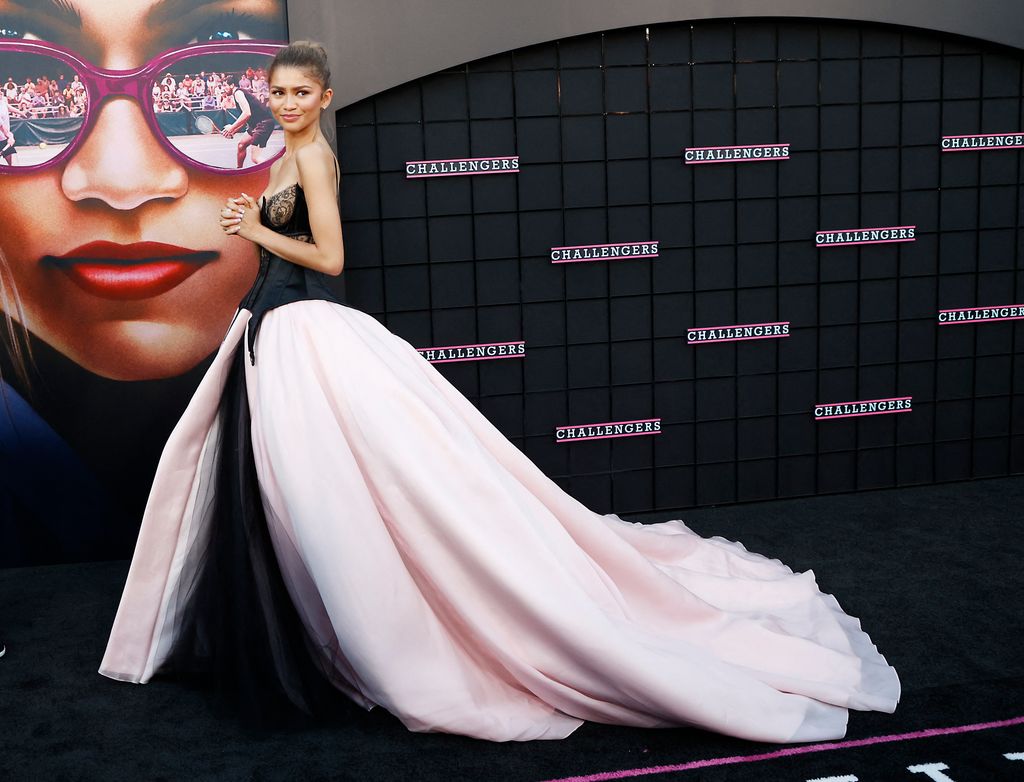 Zendaya on red carpet turned to side in ballgown