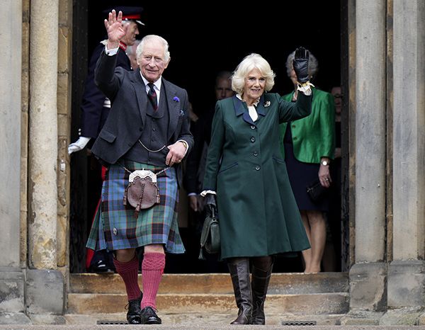 Queen Consort Camilla rocks knee-high boots and designer jewellery in ...
