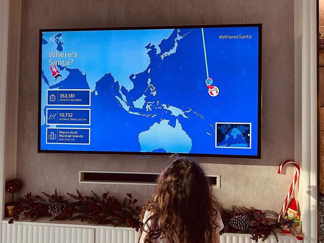 patricia lampard frank daughter watching world map on tv screen