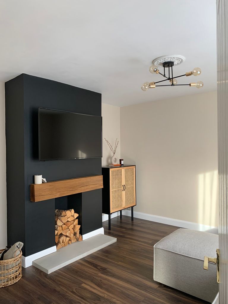 living room with black fire breast 