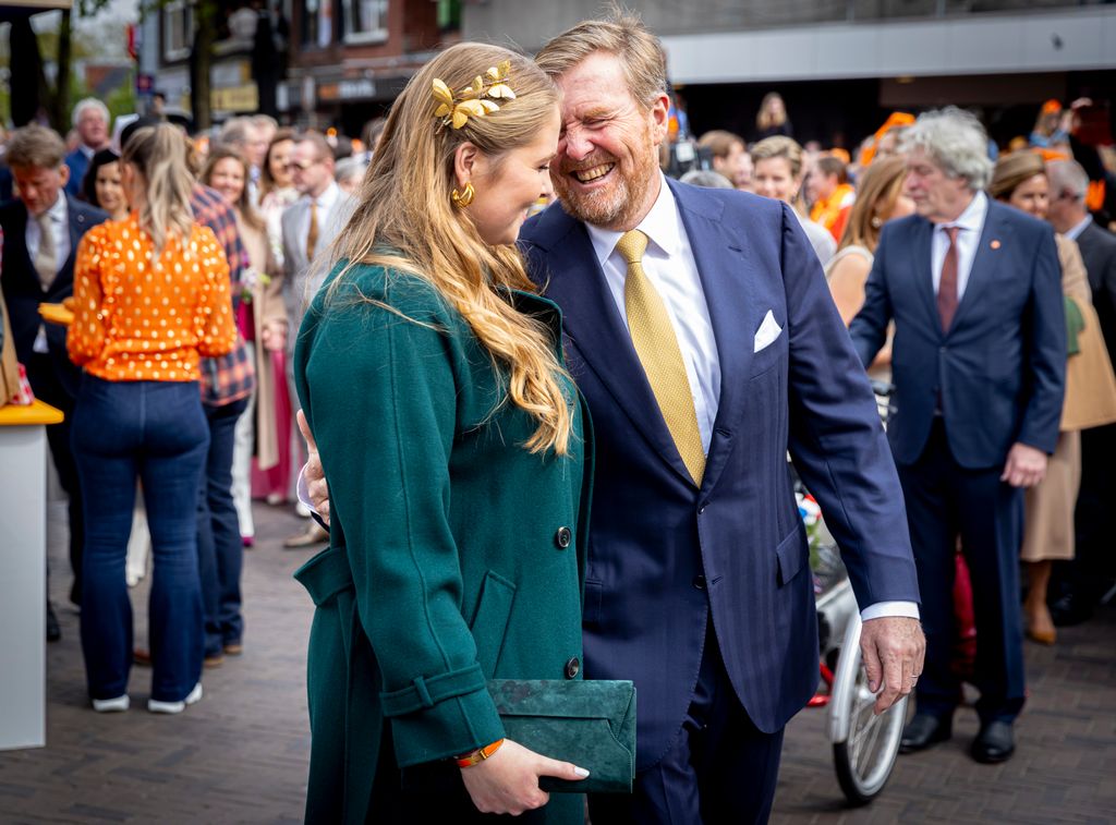 King Willem-Alexander with his arm around Crown Princess Catharina-Amalia