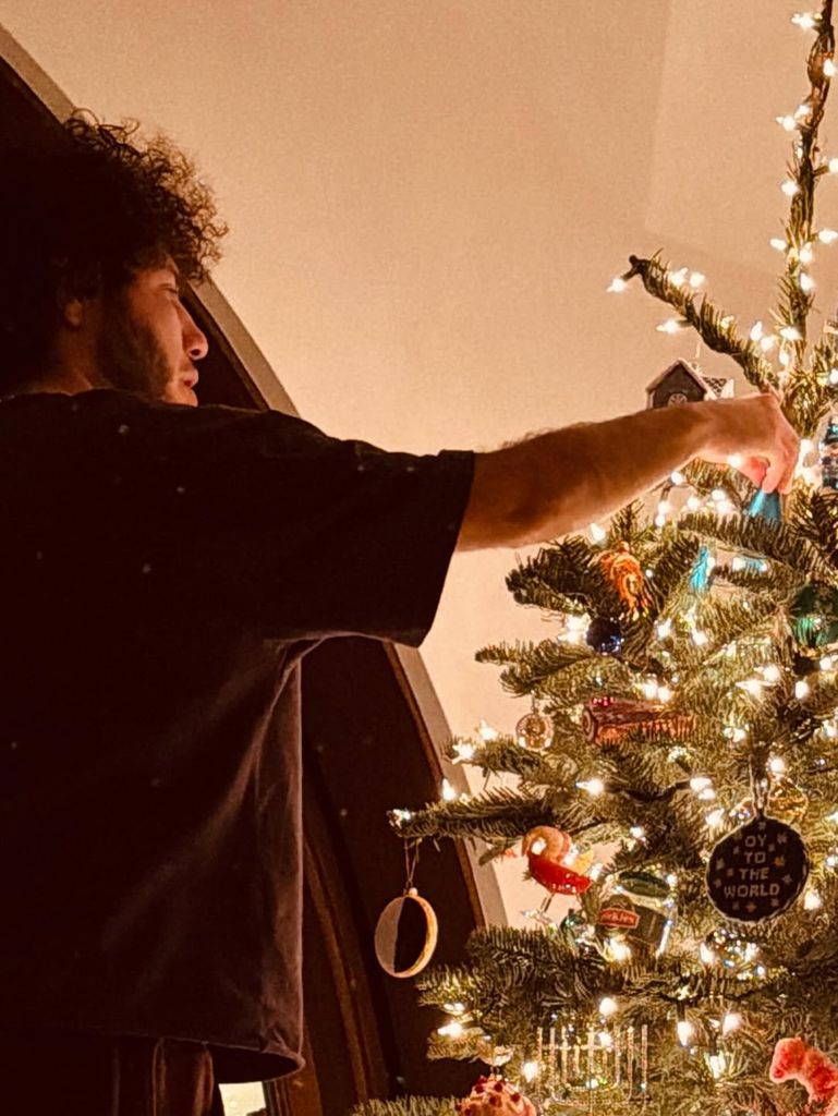 Benny Blanco decorating Christmas tree