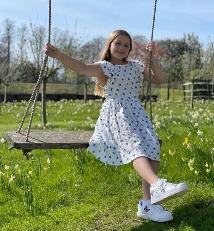 Harper Beckham in a polka dot dress
