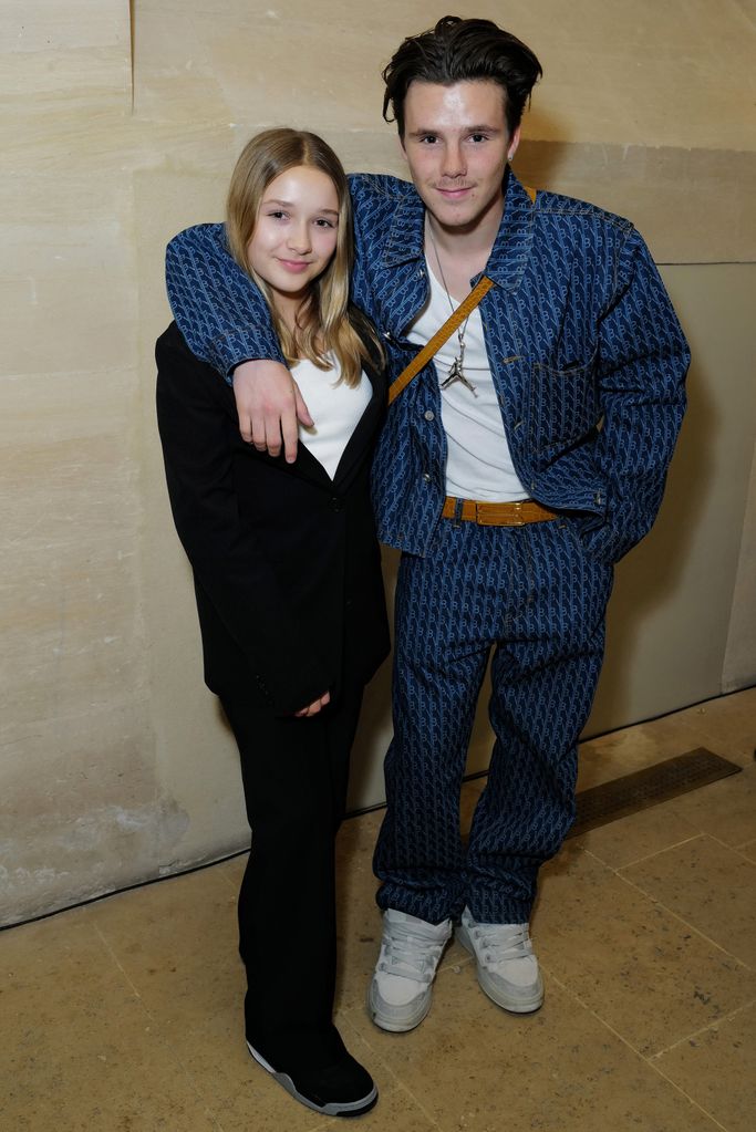 Harper Beckham and Cruz Beckham attend the Victoria Beckham FW23 show during Paris fashion week on March 03, 2023 in Paris, France