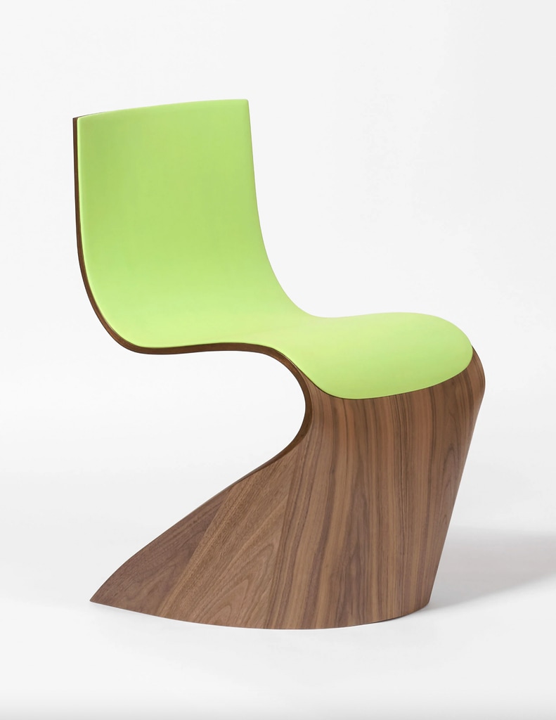 Pierre Renart's sculptural chair created for Longchamp, featuring curved wood and a bright green leather seat
