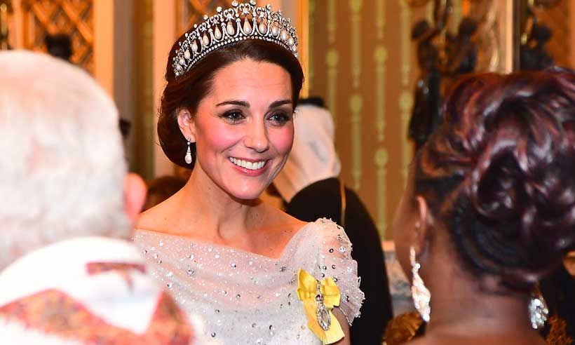 kate middleton wearing a tiara with a sparkling dress
