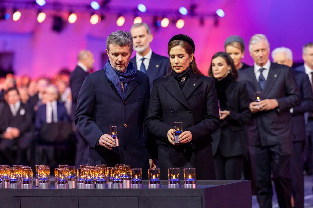 King Frederik X of Denmark and Queen Mary putting tealight on table