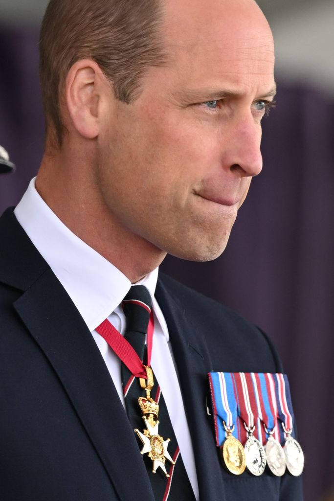 man in suit with medals 