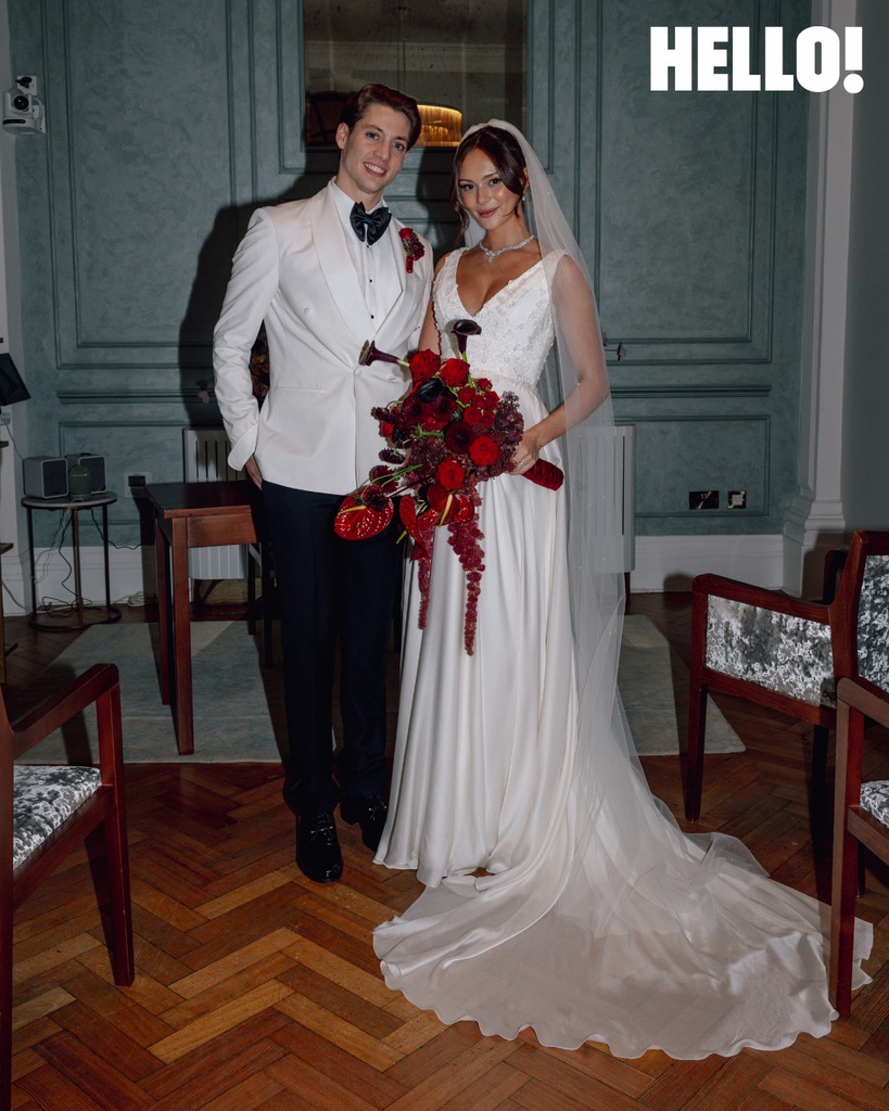 sam in white suit and alice in bridal gown