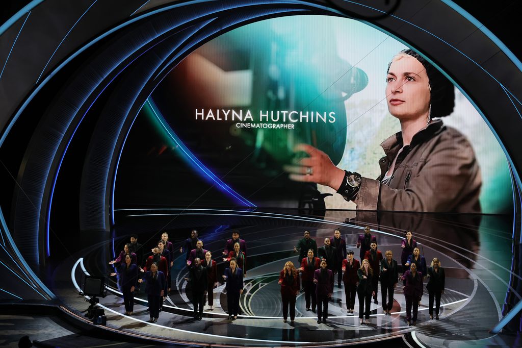 An image of the late Halyna Hutchins is projected onto a screen as part of a memorial tribute during the 94th Annual Academy Awards