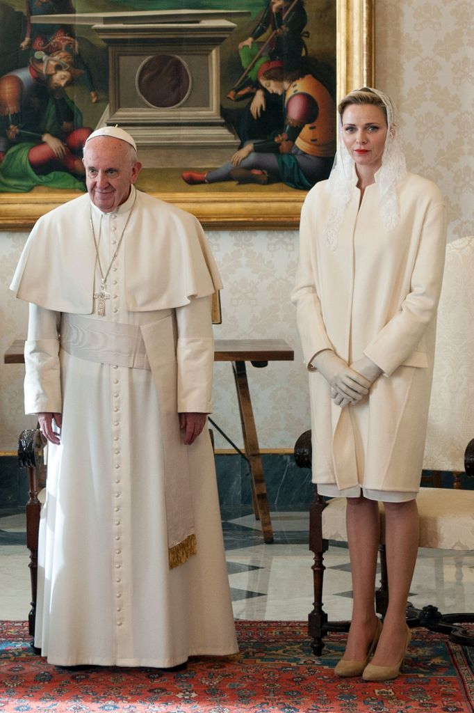 Pope Francis next to Princess Charlene in a white coat and lace veil