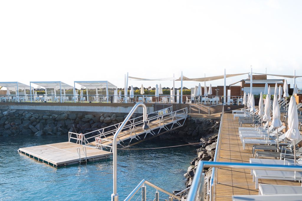 A photo of La Punta Yacht Club in marina of Pasito Blanco Gran Canaria