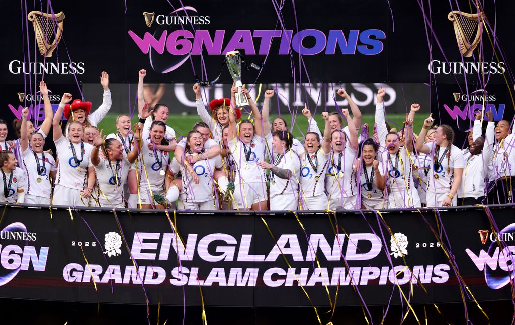 Zoe Aldcroft of England lifts the Guinness Womenâs Six Nations trophy, after England defeated France to secure a Grand Slam and be crowned as Six Nations Champions