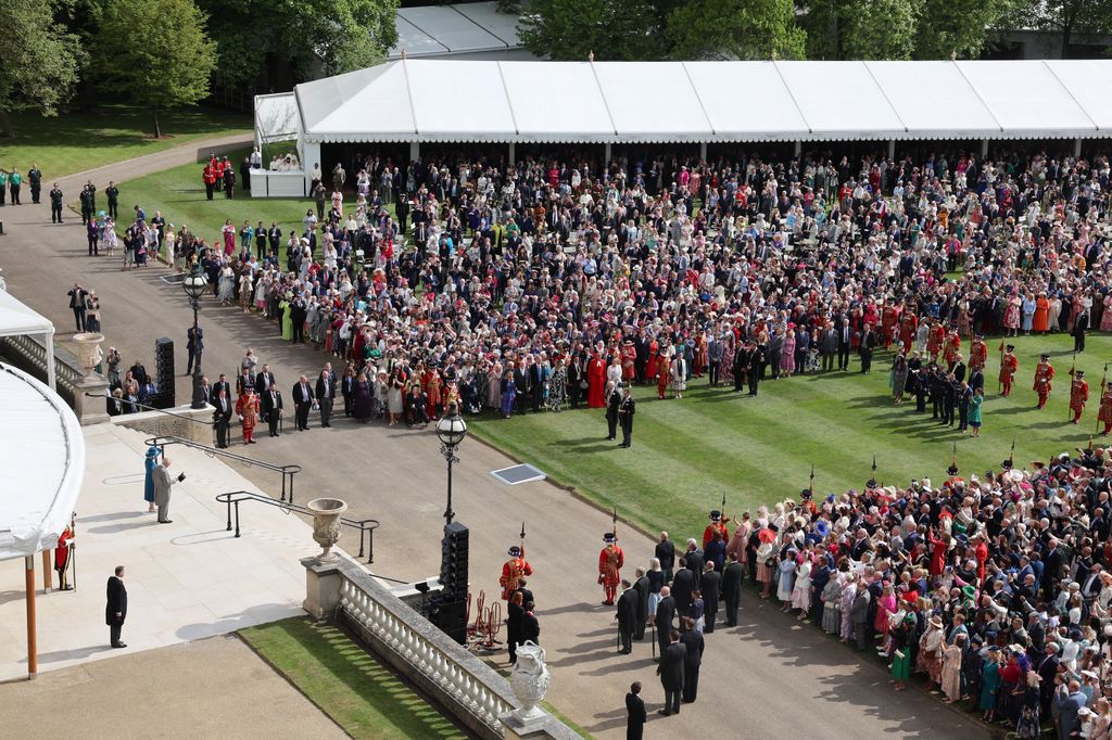 King Charles III and Queen Camilla stand at the top of the Garden steps, as the National Anthem is played
