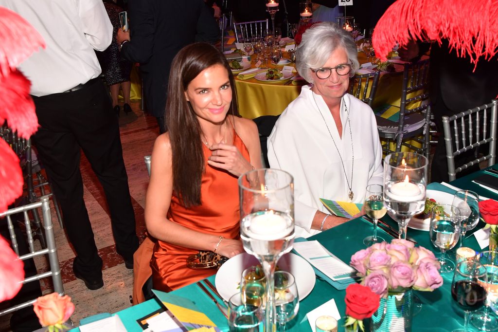 Katie Holmes and her mom Kathleen sitting at a table