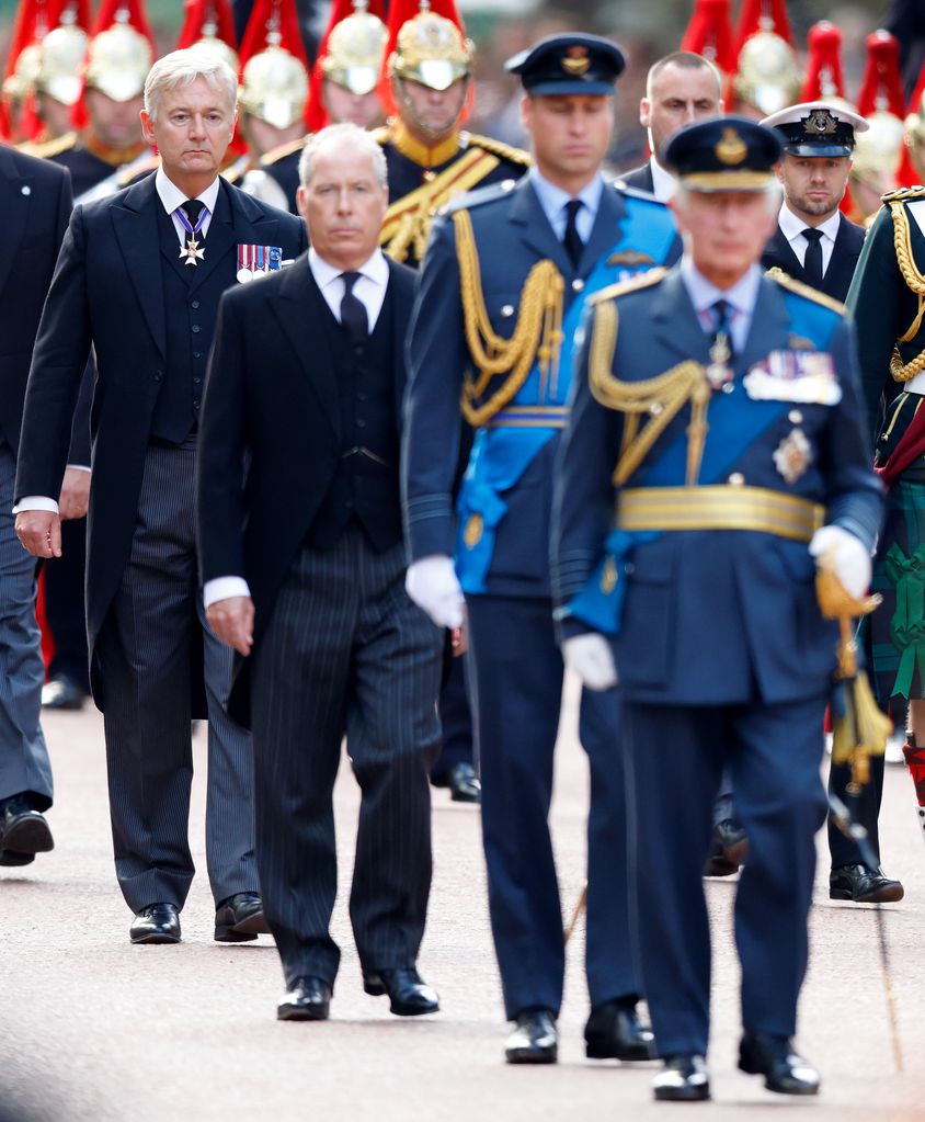 Sir Clive Alderton pictured walking with the royal family behind Queen Elizabeth II's coffin