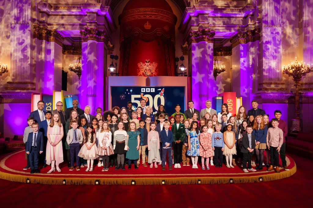 Queen Camilla with a group of celebrities and children
