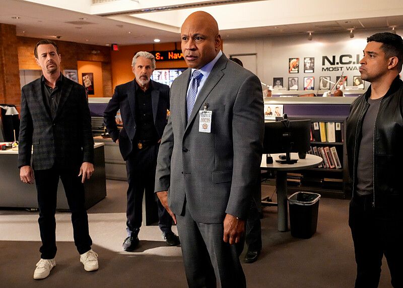 four men standing in ncis hq