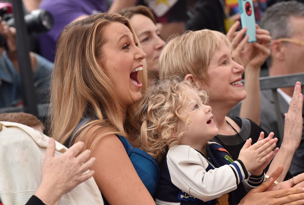 Blake Lively smiling and clapping with daughter James Reynolds