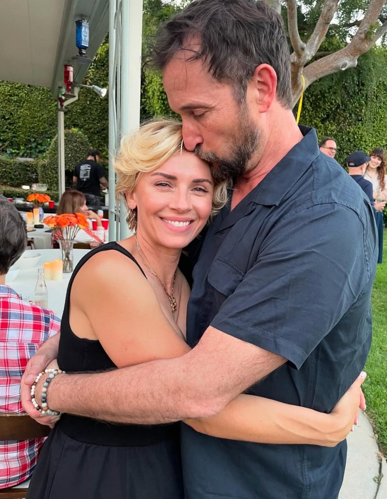 Photo shared by Noah Wyle's wife Sara Wells on Instagram of the two in an embrace