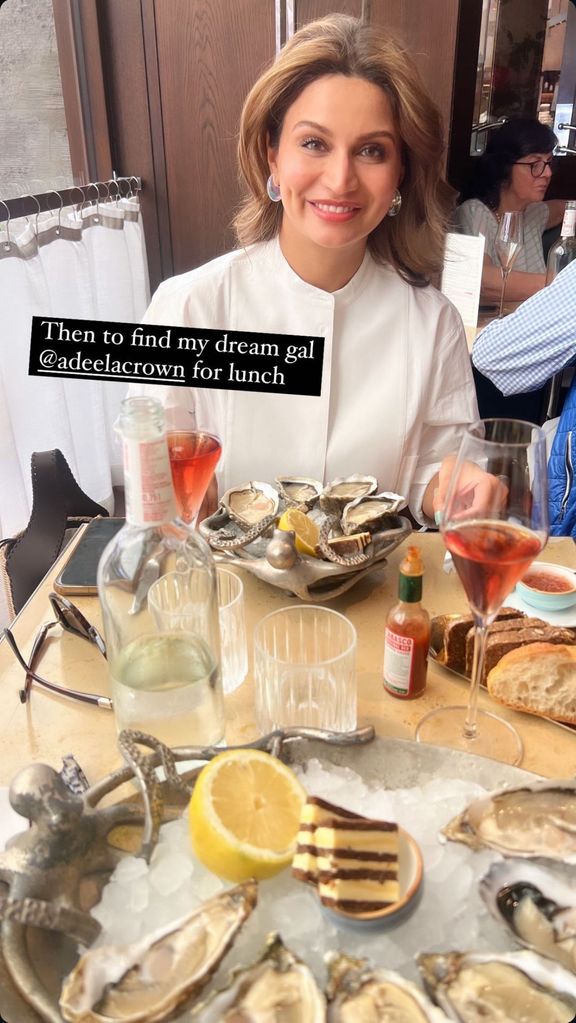 Adeela, Carrie Johnson's friend with two plates of oysters