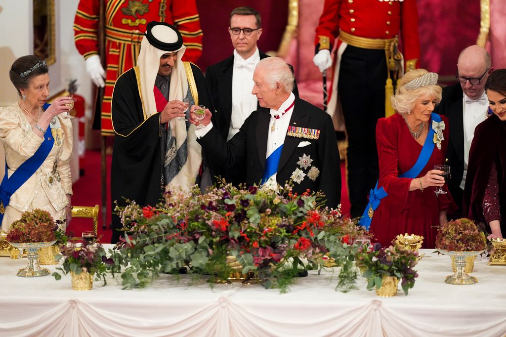 Anne and Charles toasting the Emir of Qatar