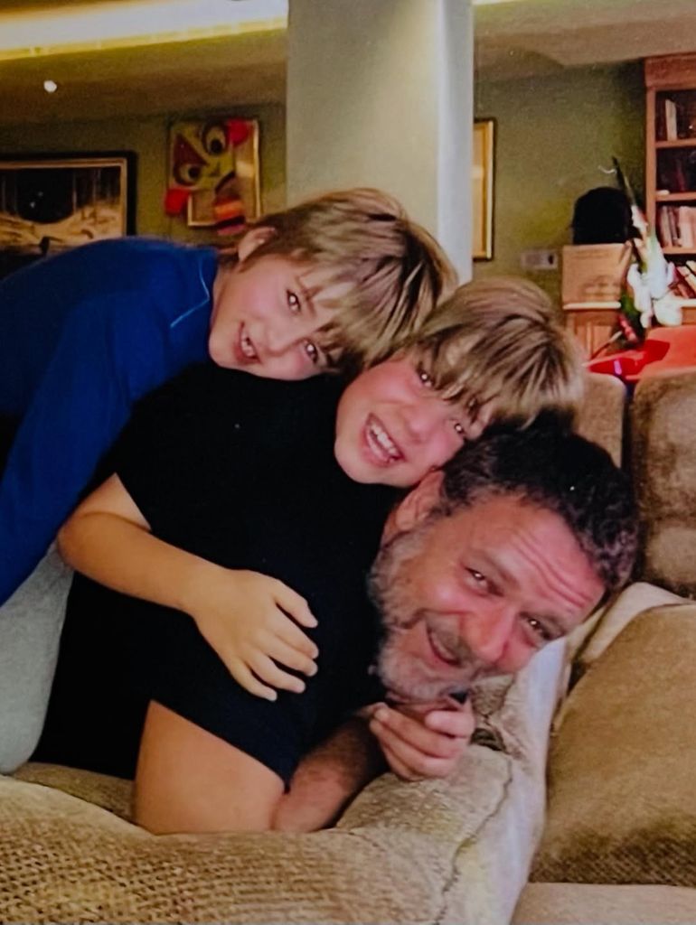 Russell Crowe's sons Charles and Tennyson climb on top of him for a family photo shared on Instagram