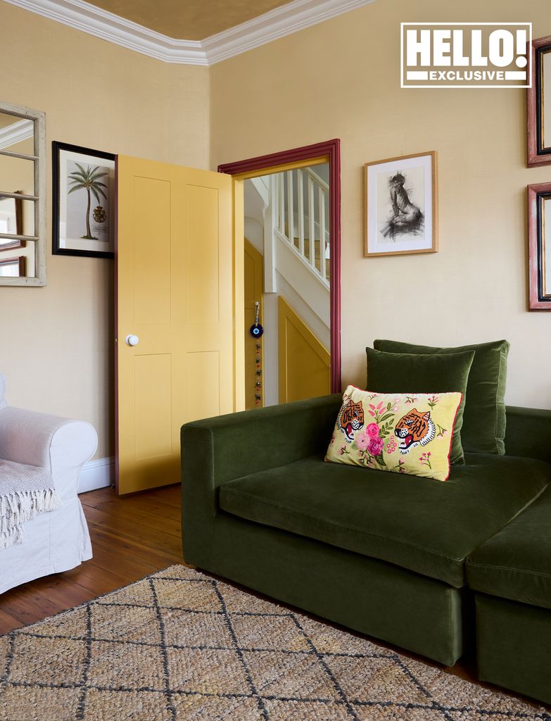 Designer Daisy Knatchbull's peach living room with green sofa at home in London