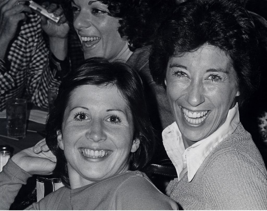 Ann Travolta and Ellen Travolta smiling in a black and white photo