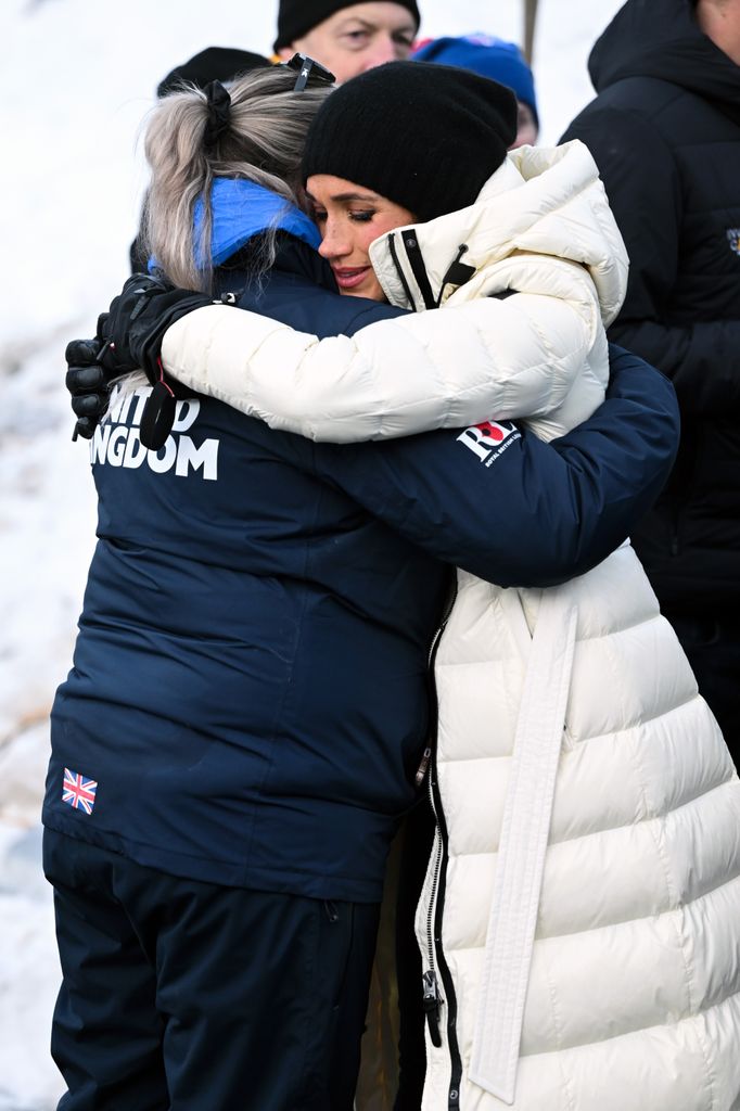 Meghan hugs a member of Team UK