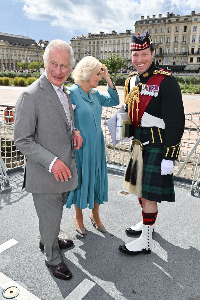 King Charles with Queen Camilla and Major Jonathan Thompson in France