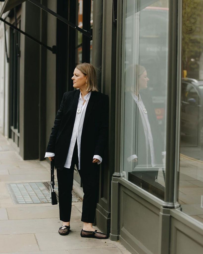 INfluencer Sam Preston in white shirt and black suit