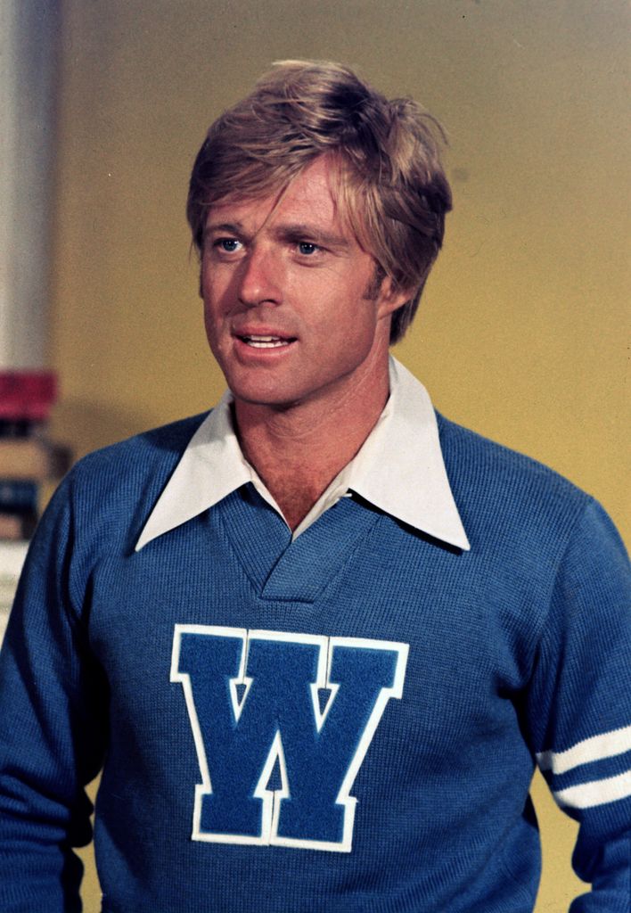 Robert Redford wearing a sweater with the letter "W" on the front and a wide, white collar. ca. 1960's