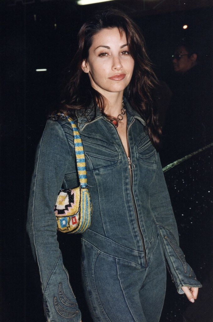 Portrait of American actress Gina Gershon as she arrives for an MTV Video Music Awards after party in double denimn 