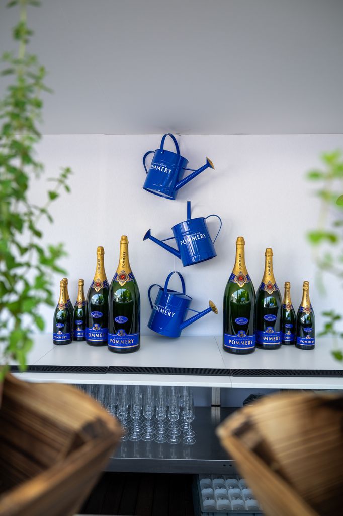 bottles of pommery sparkling wine on outdoor terrace