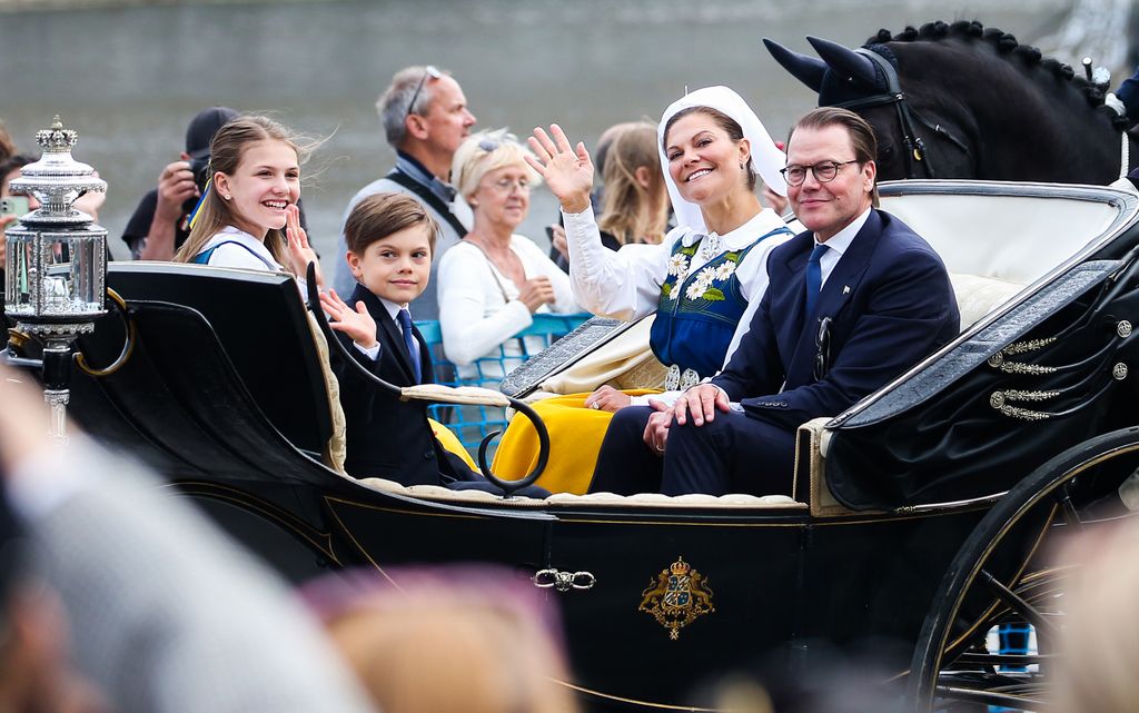 Crown Princess Victoria of Sweden, Prince Oscar of Sweden, Princess Estelle of Sweden, and Prince Daniel of Sweden in a carriage