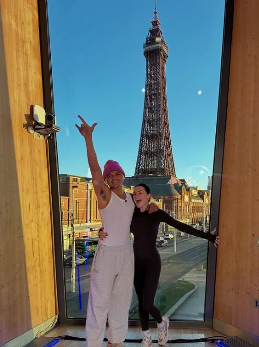 Nikita Kuzmin and Amber Davies in front of the Blackpool power, Nikita is wearing his libre sensor