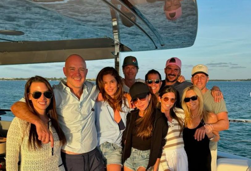 Victoria Beckham and David Beckham on a boat with several friends