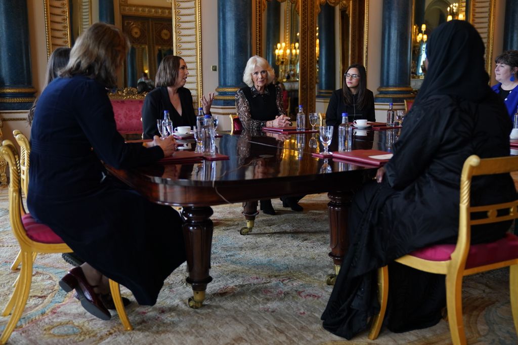 Queen Camilla sitting at the table with SafeLives changemakers