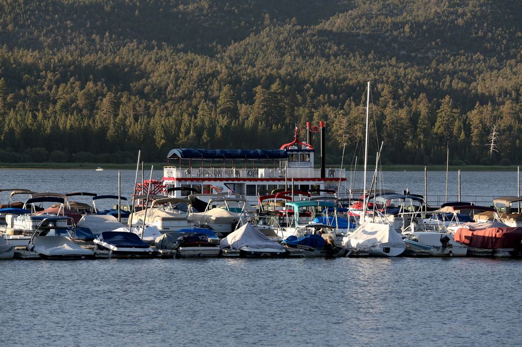 A scenic view of boats moored to a dock at Big Bear Lake, California on August 18, 2014