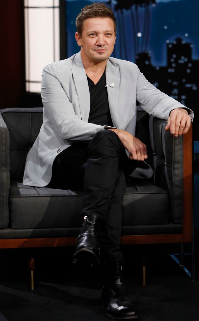 Jeremy Renner sat in a chair